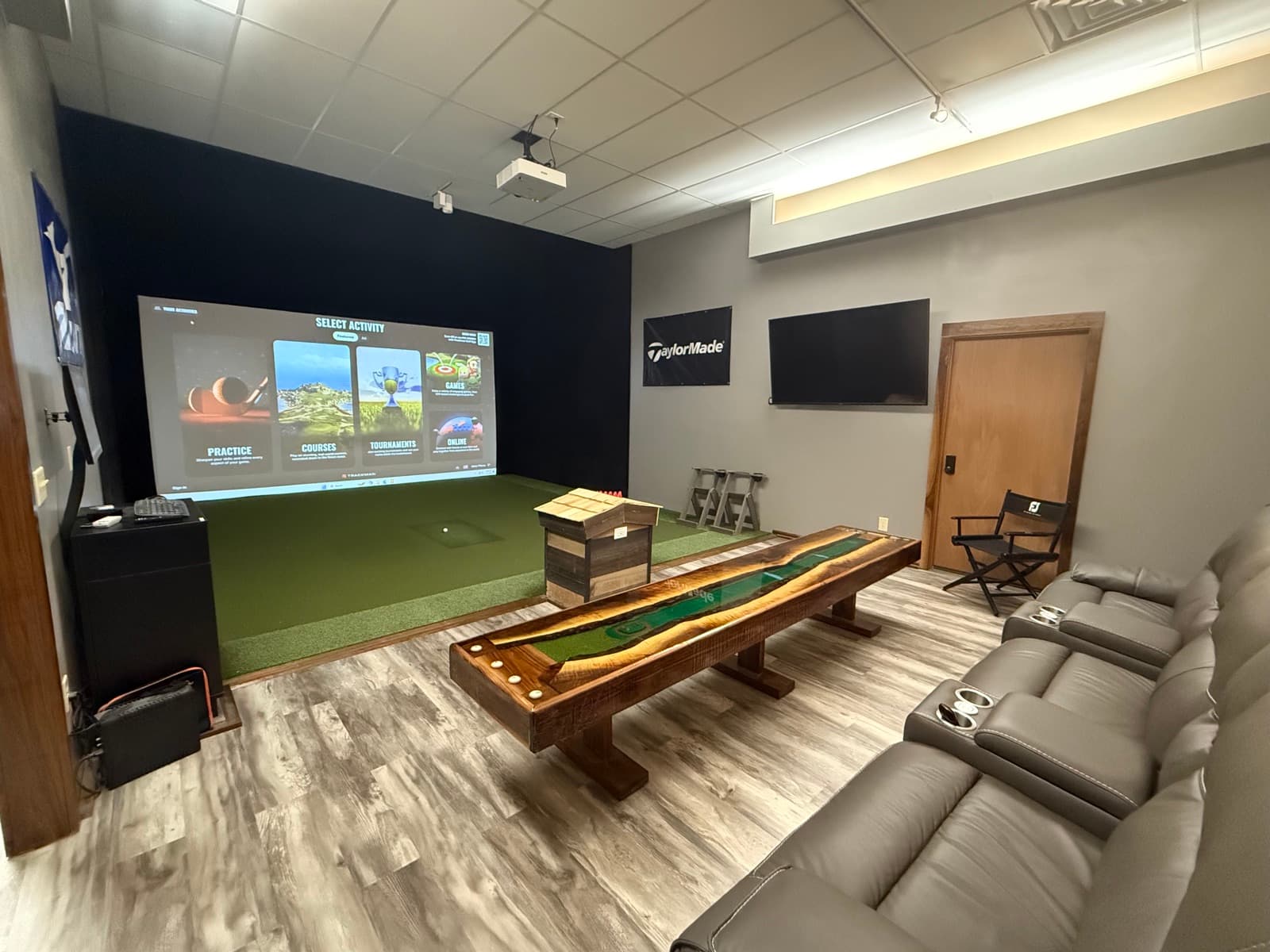 The Private Suite: TrackMan simulator, plush seating, and shuffleboard