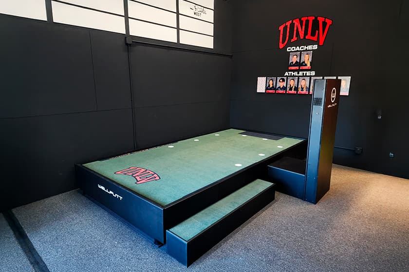 A Wellputt BigTilt tilting putting platform installed at an indoor facility